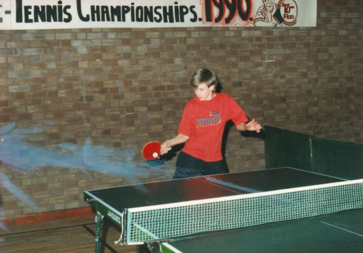 A member playing at the Patrician Youth Centre Table Tennis Championships, 1990